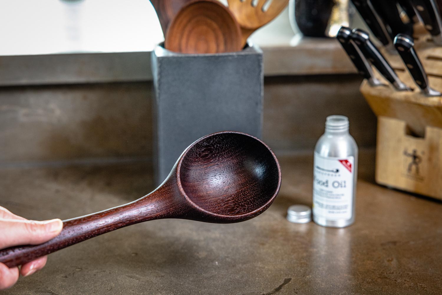 freshly oiled wood ladle with butcher block oil