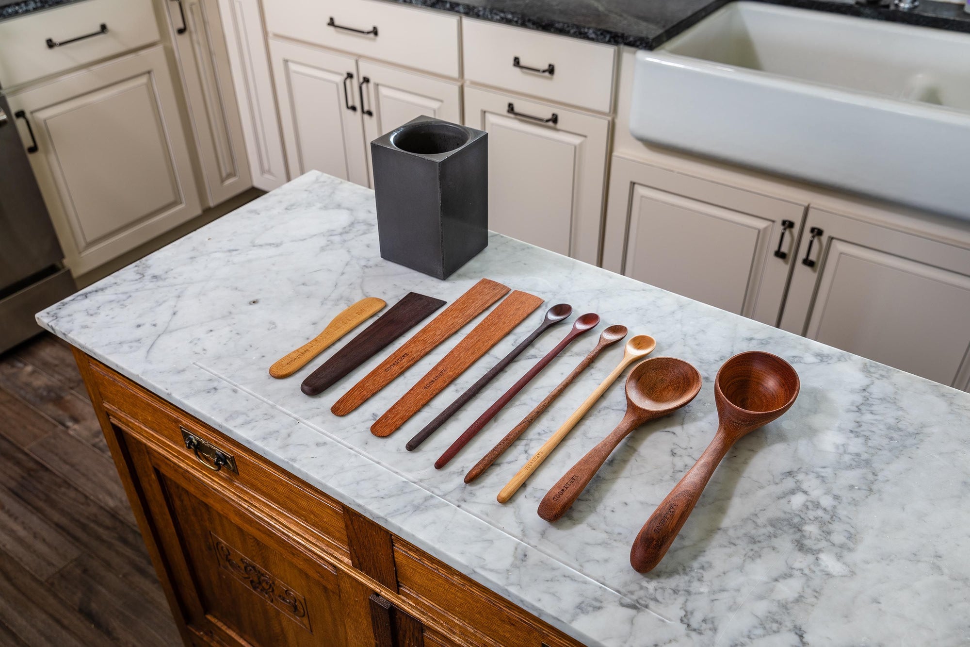 Wooden utensils laying on kitchen counter
