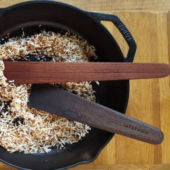 Wooden spatulas for cooking in cast-iron pan