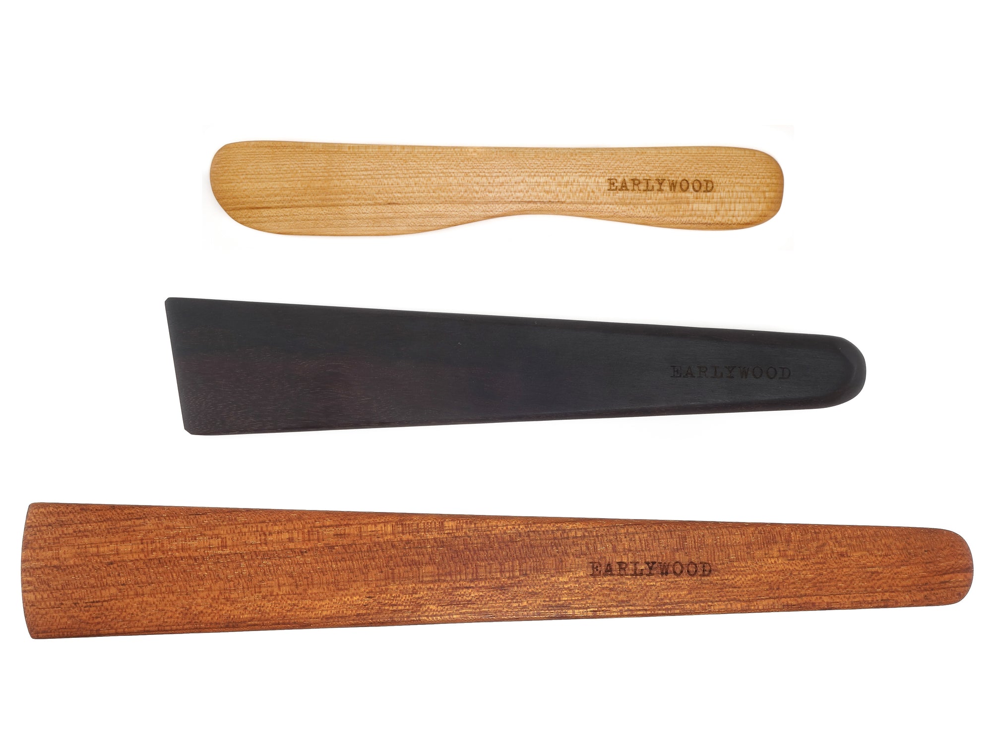 set of three wooden kitchen utensils, wooden spatula, cast iron scraper, and wooden spreader