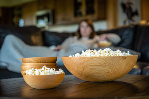 wooden bowl set with popcorn