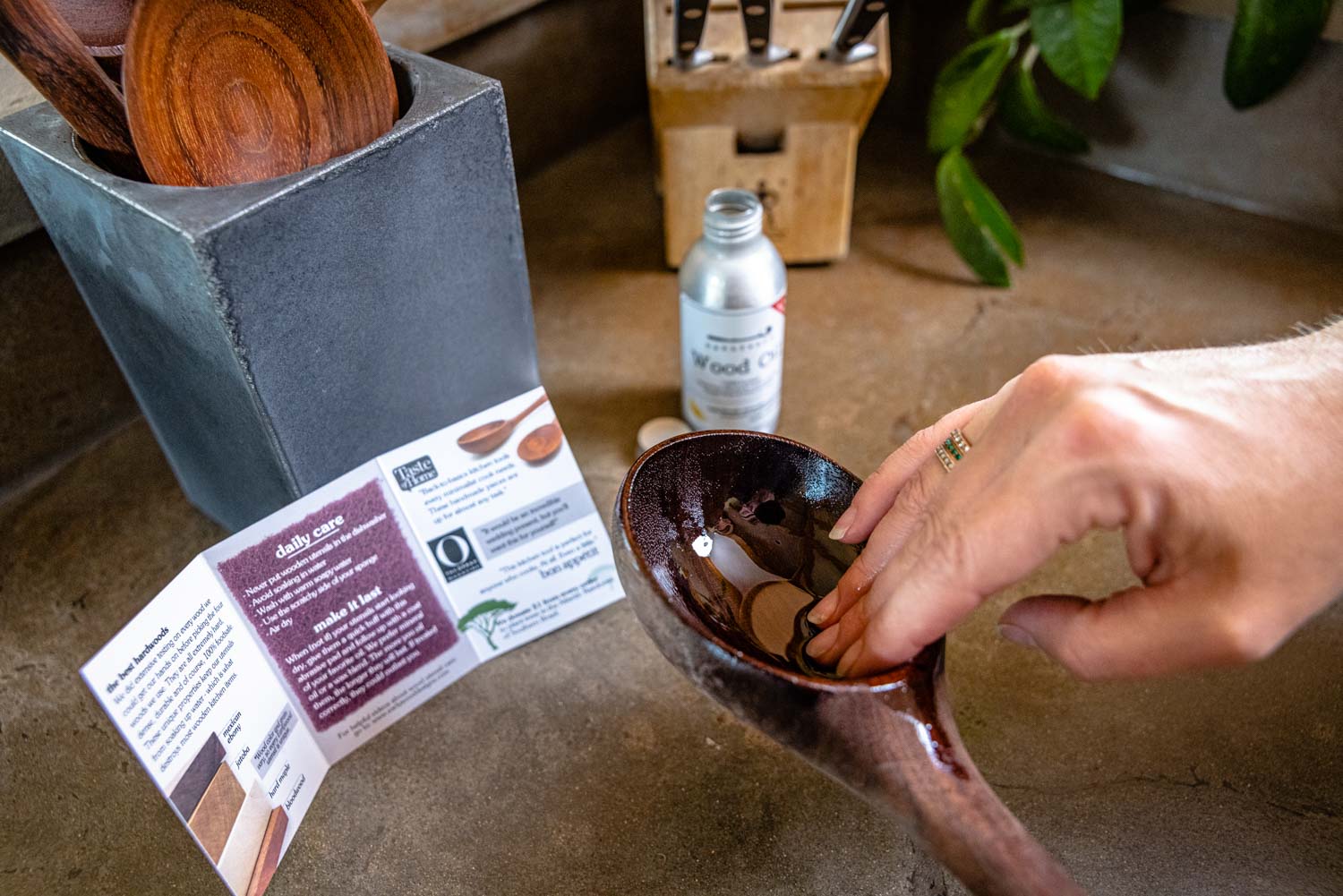 rubbing mineral oil into wood ladle