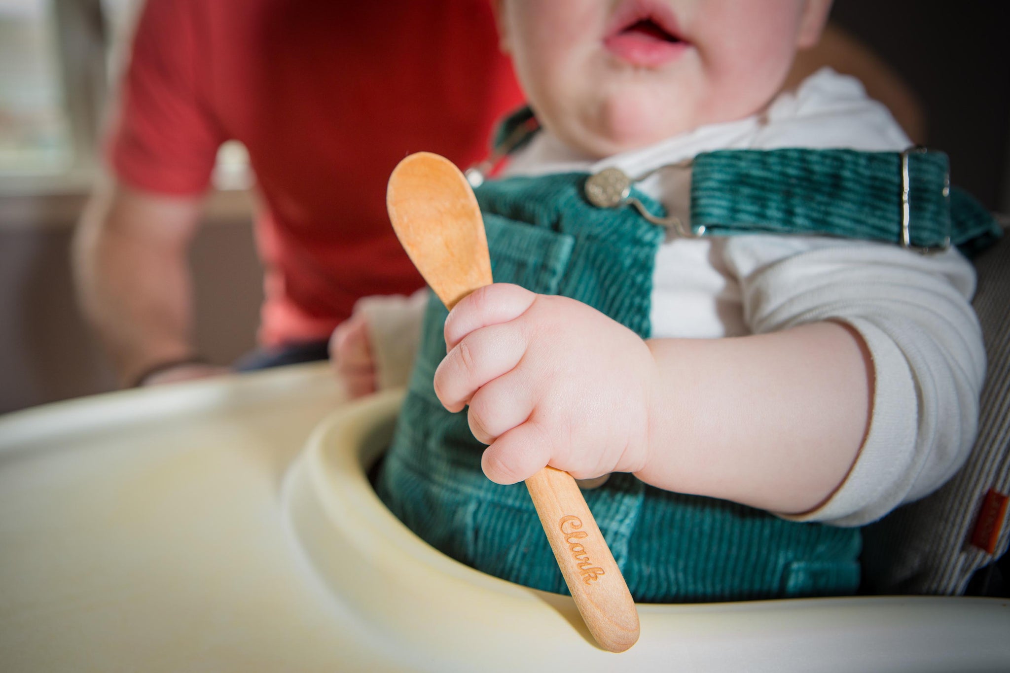 small wooden bowl with wooden baby spoon